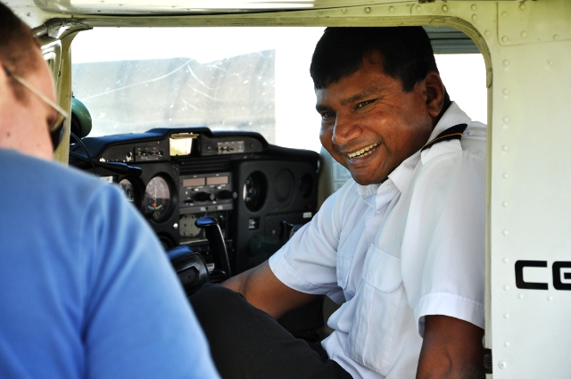 First Solo Smile: Roshan being greeted by his instructor Alex Cameron after Roshan's first solo flight.