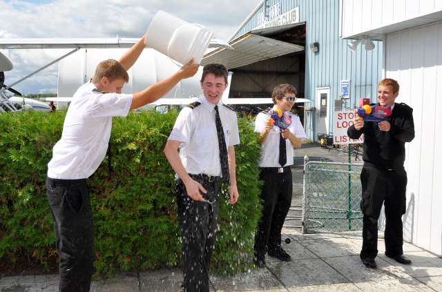 Wet Welcome: Joshua getting congratulated by his classmates.