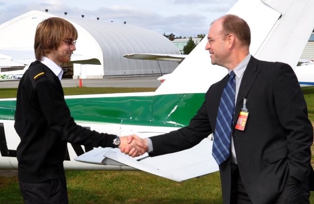 Cameron and Mike: A handshake from OFC CEO Mike McKay while Cameron's still dry.